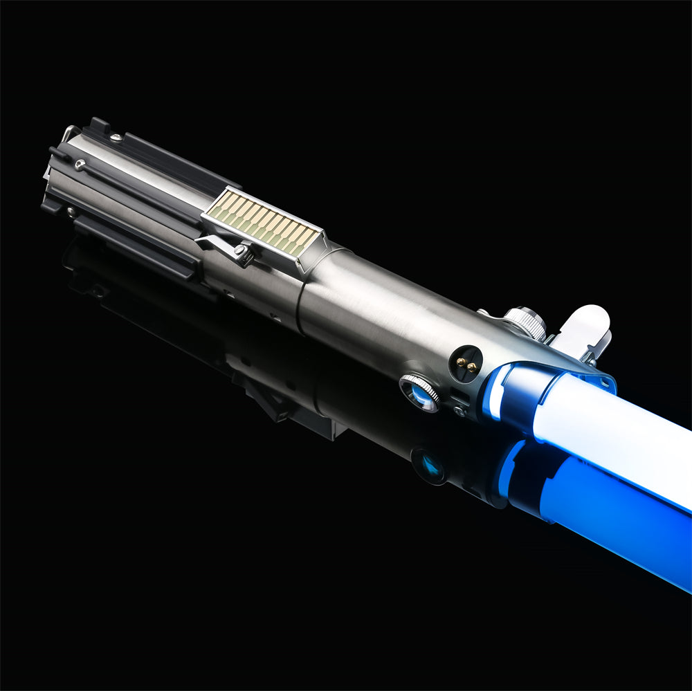 The Twin Sun combat saber, brushed silver hilt laid flat with a blue blade ignited
