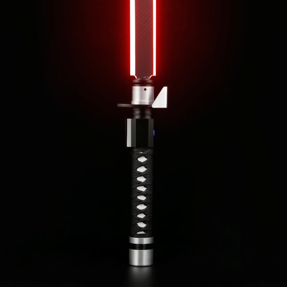 Solitude SE katana-style saber, black hilt with a white diamond pattern and an angled red blade